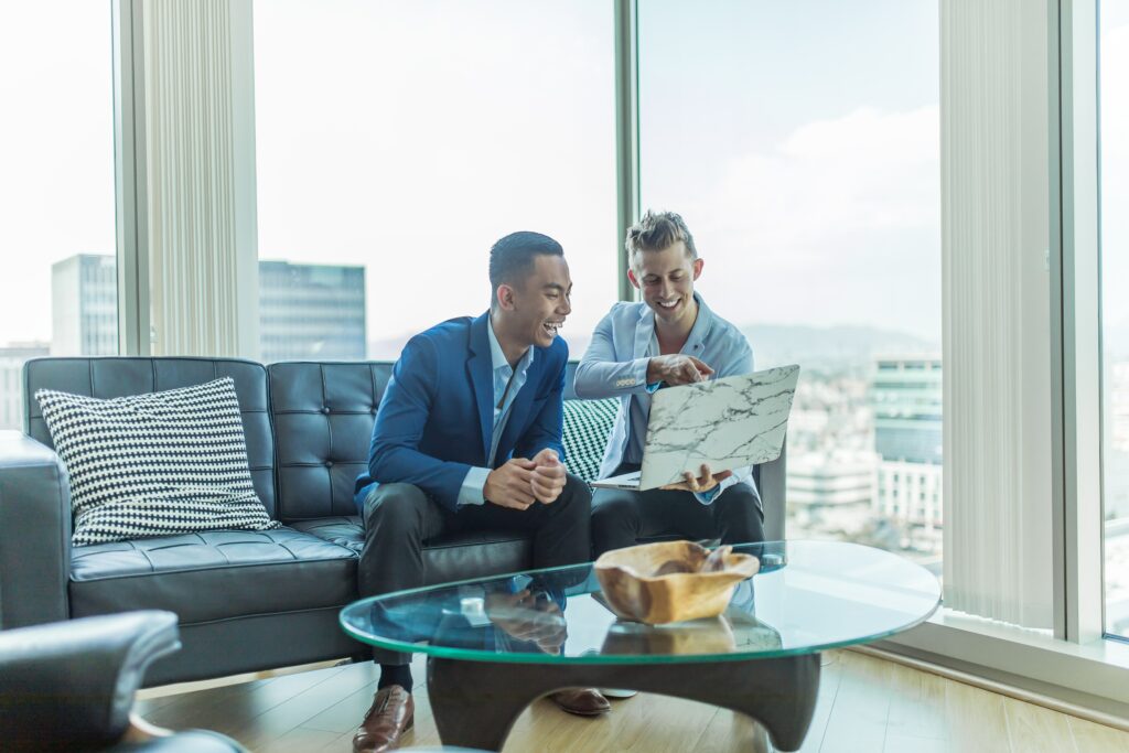 Two employees performing market research